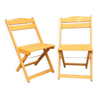 Pair of folding chairs in blond wood
