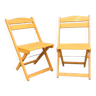 Pair of folding chairs in blond wood