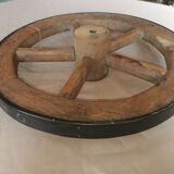 Old wheelbarrow or plow wheel