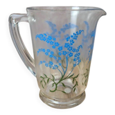 Glass jug with vintage blue floral decoration