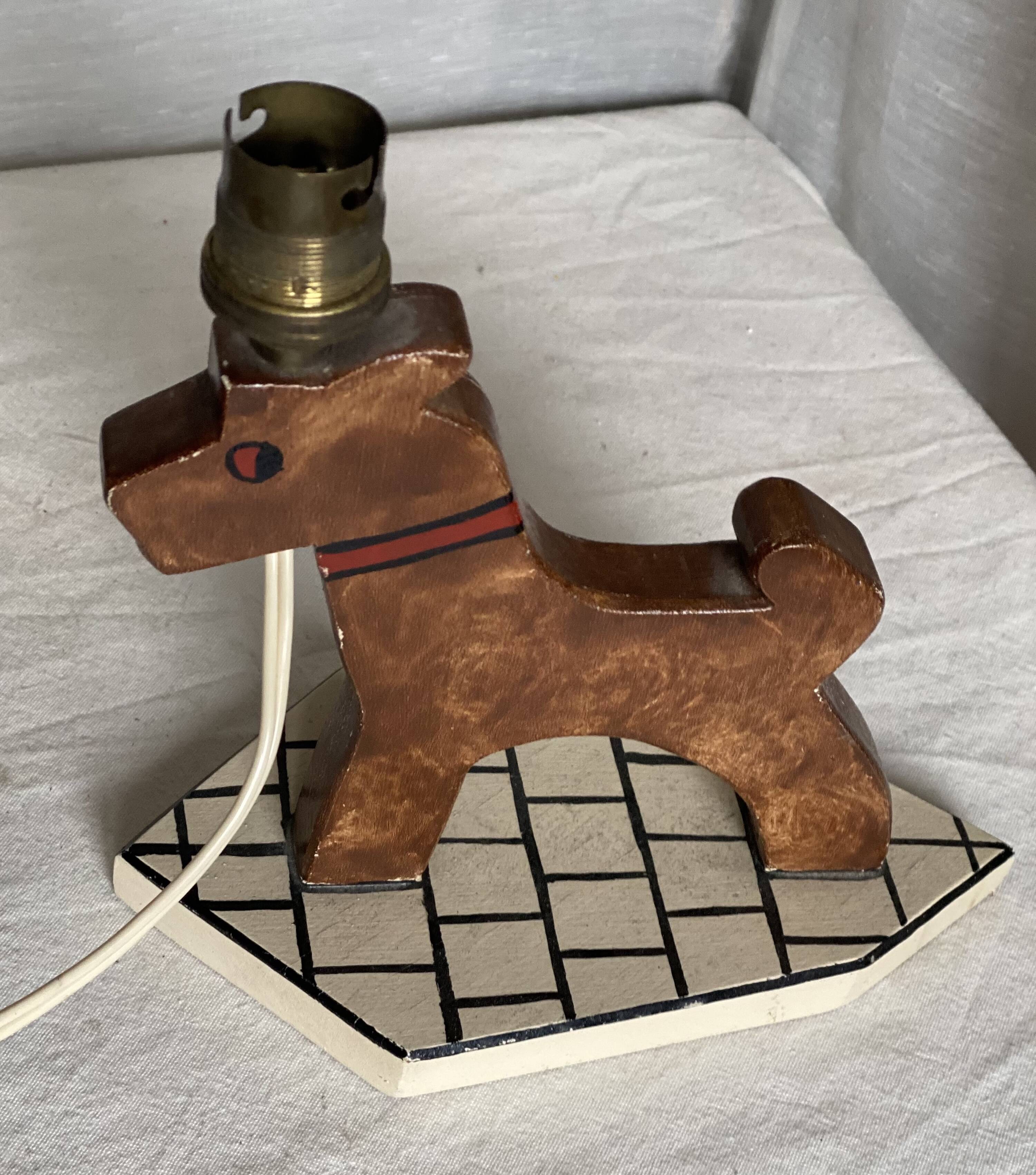Vintage 1970s polychrome wooden lamp in the shape of a dog.