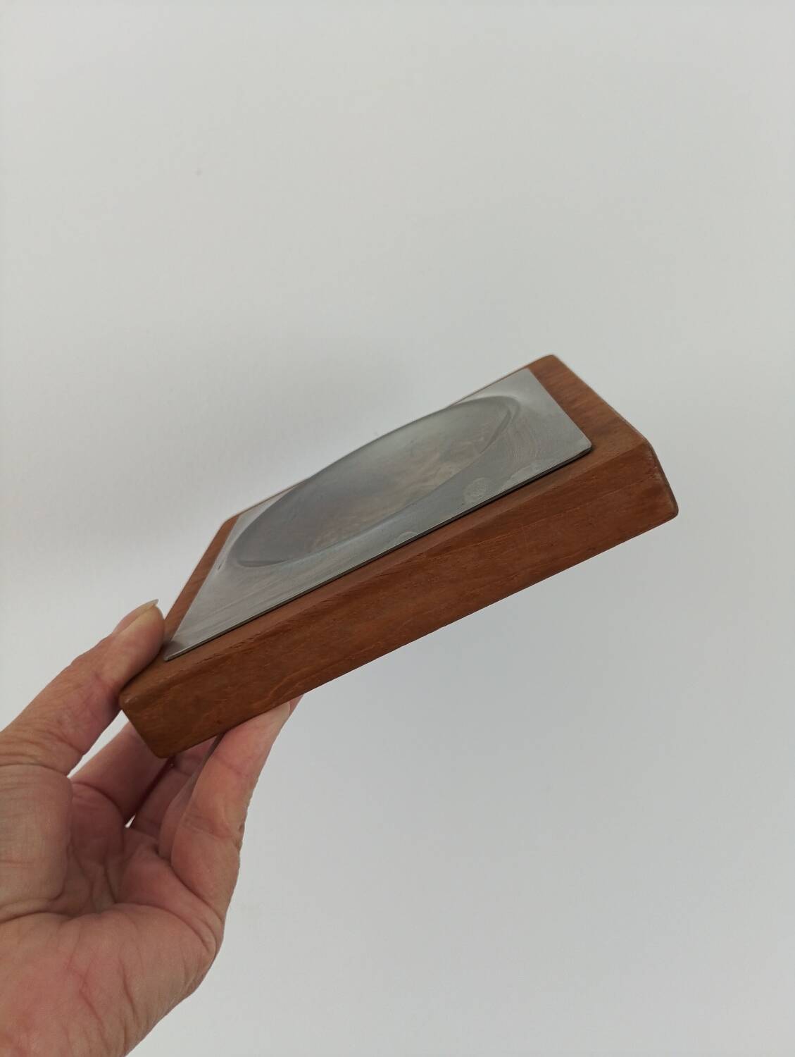 Stainless steel and wood pocket emptier