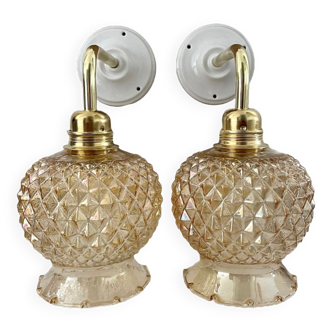 Set of two wall sconces in gilded chiseled glass