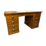 Old wooden desk has double subwoofer