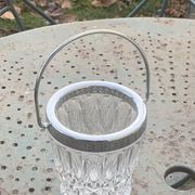 Whiskey carafe and ice bucket in transparent glass and silver-colored metal handle