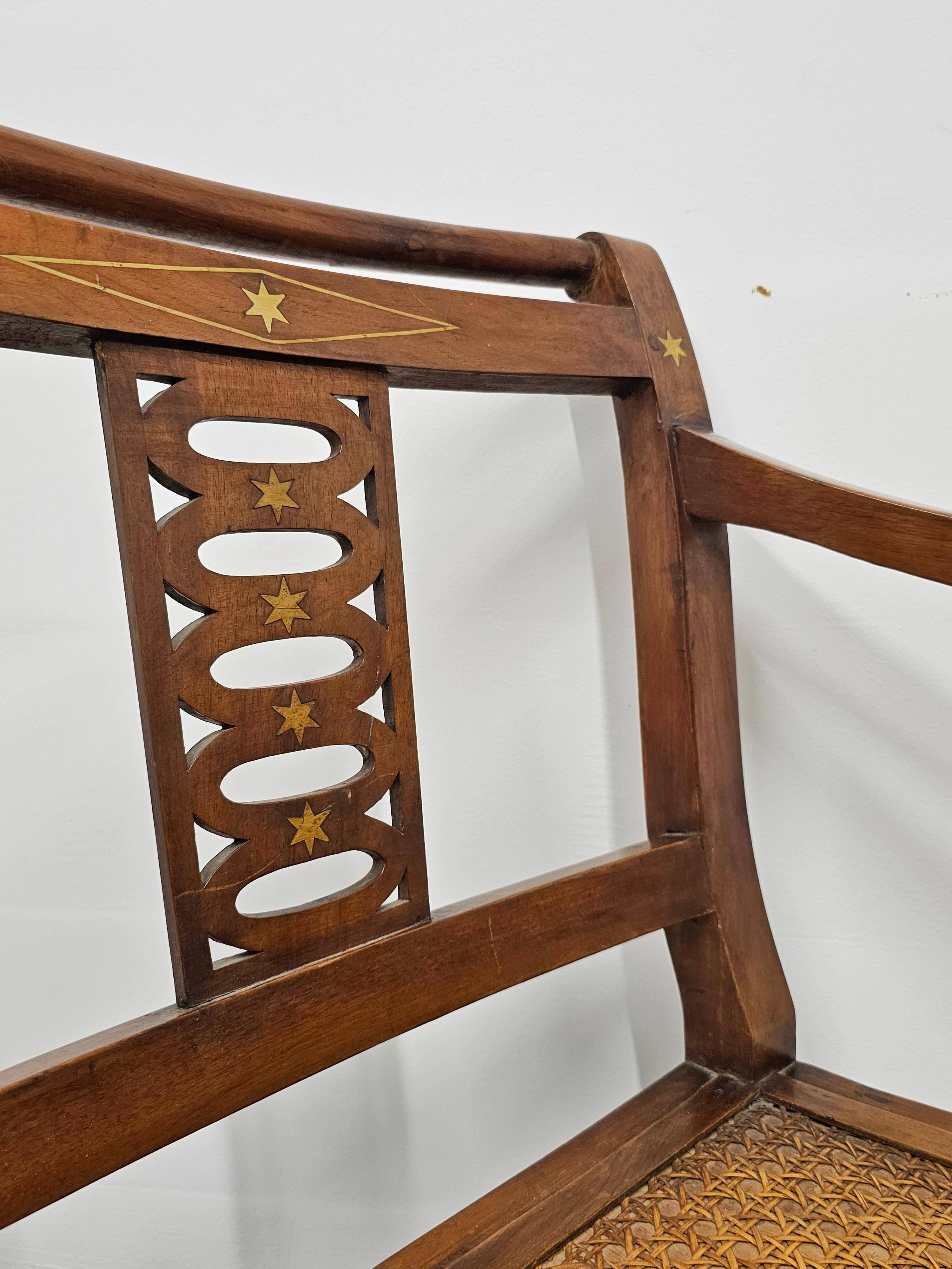 Directoire canapé in walnut with brass inlays, late 18th century.