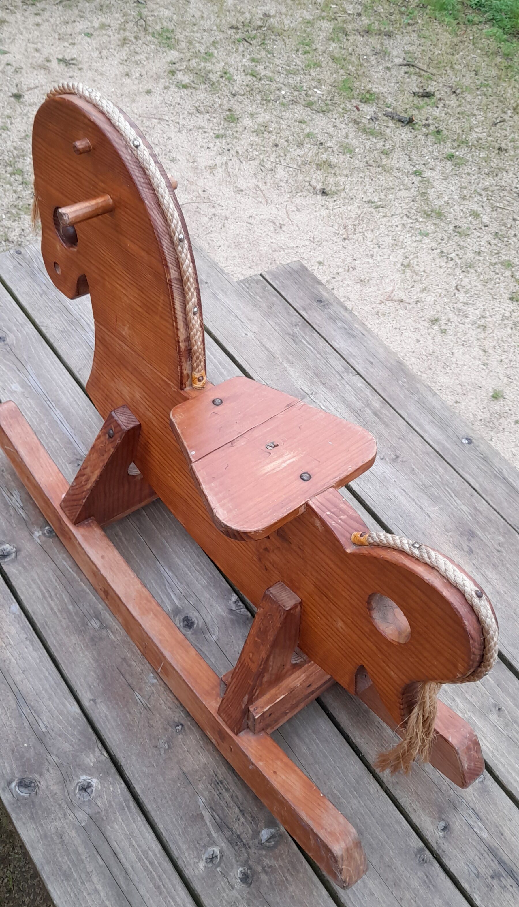 Rocking horse in raw and glazed wood