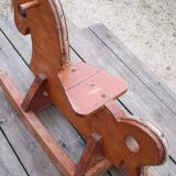 Rocking horse in raw and glazed wood