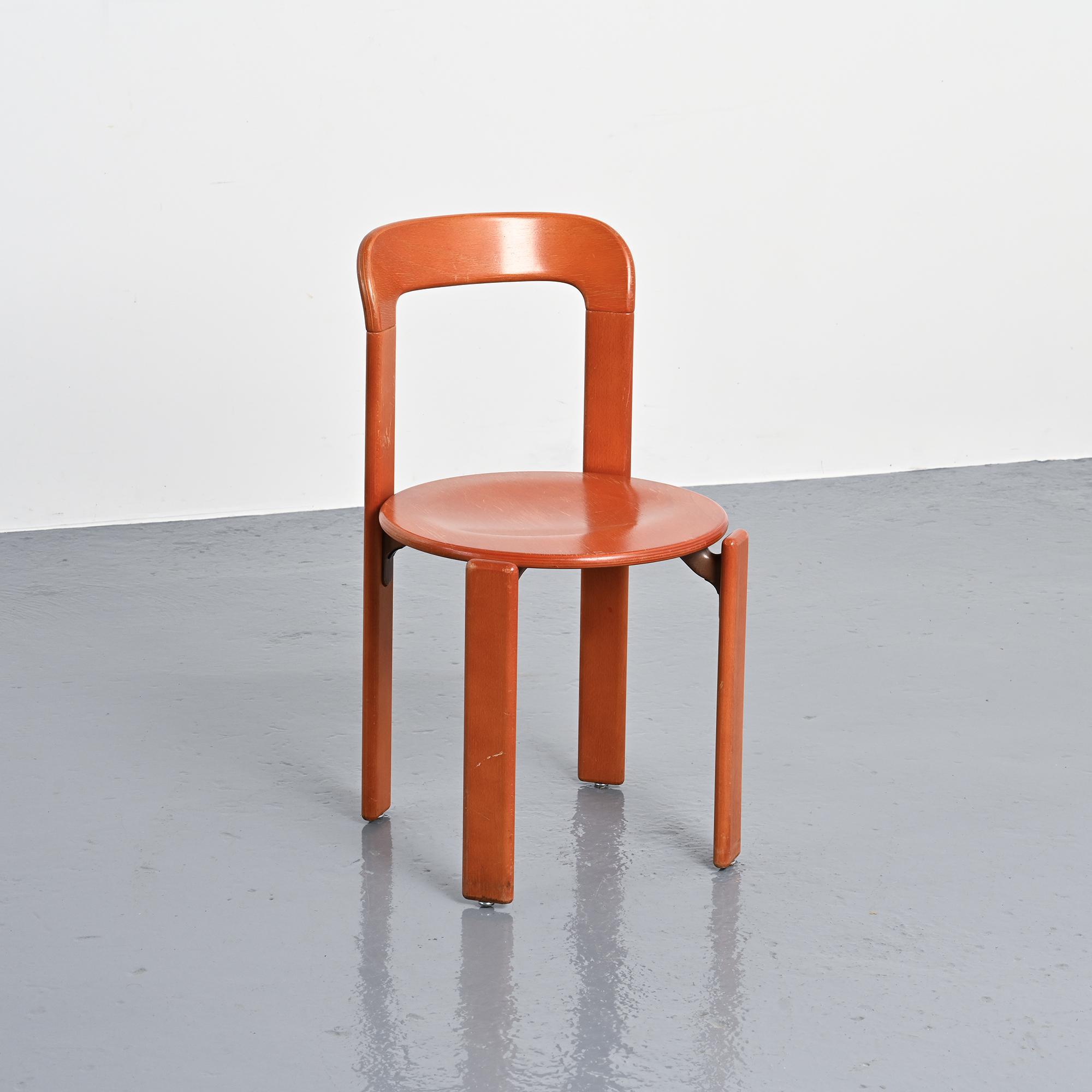Rey chairs in stained red beech by Bruno Rey