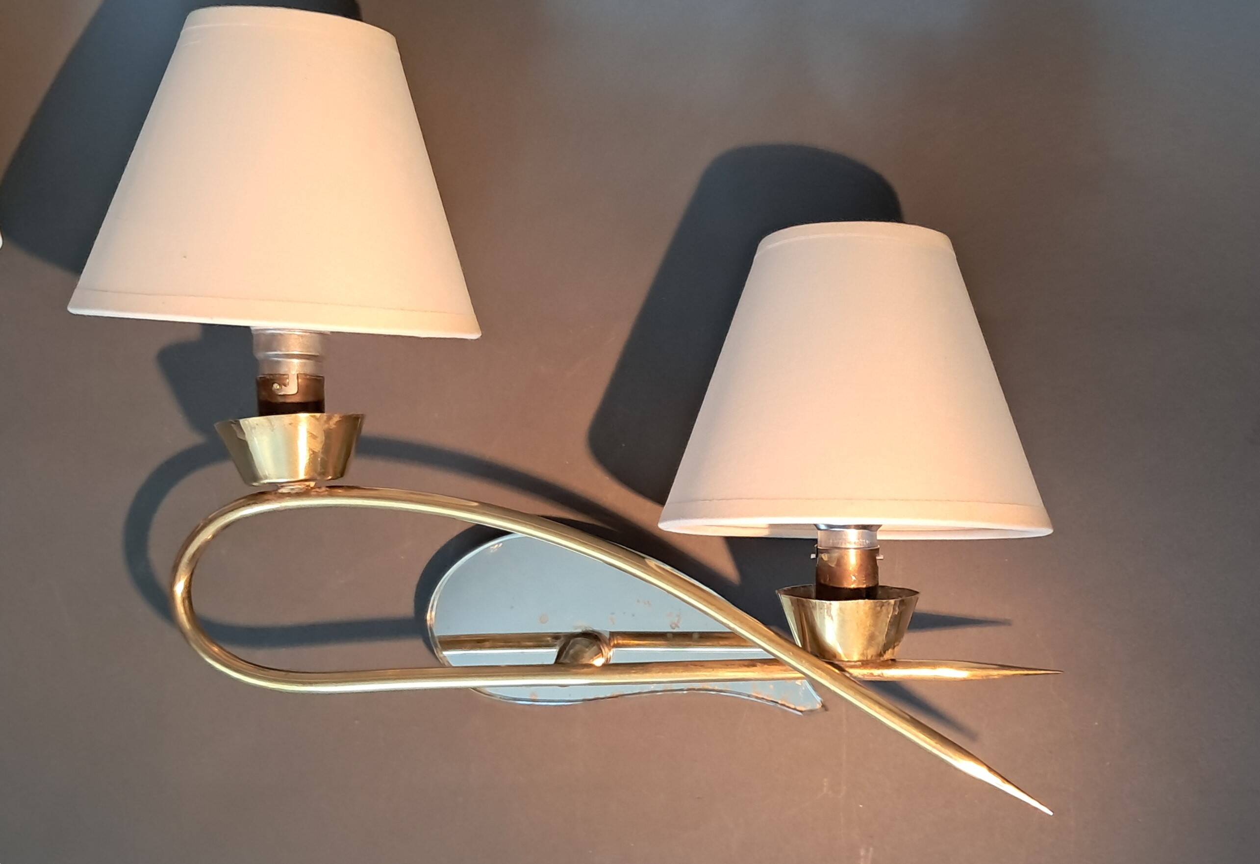 Pair of gilded brass and mirror wall lights, Circa 1960.