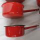 Red enamelled sheet metal pans
