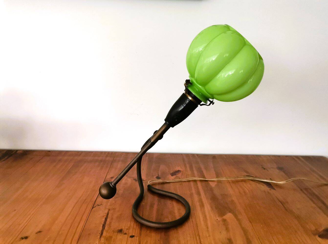 Modernist green cased glass and brass articulated table lamp