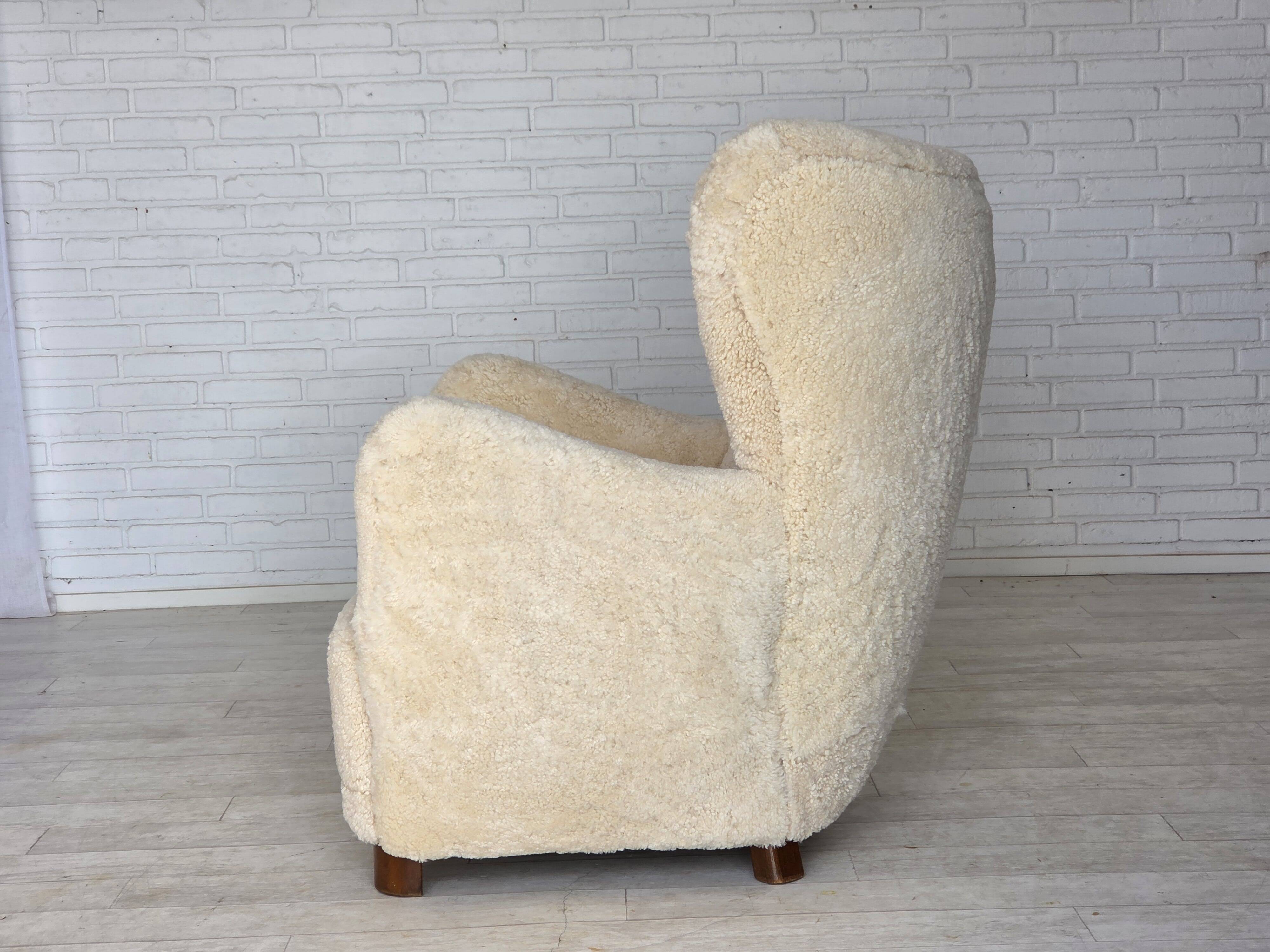 1960s, Danish armchair, genuine sheepskin "Canberra", reupholstered.