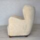 Fauteuil danois des années 1960, en véritable peau de mouton "Canberra", retapissé.