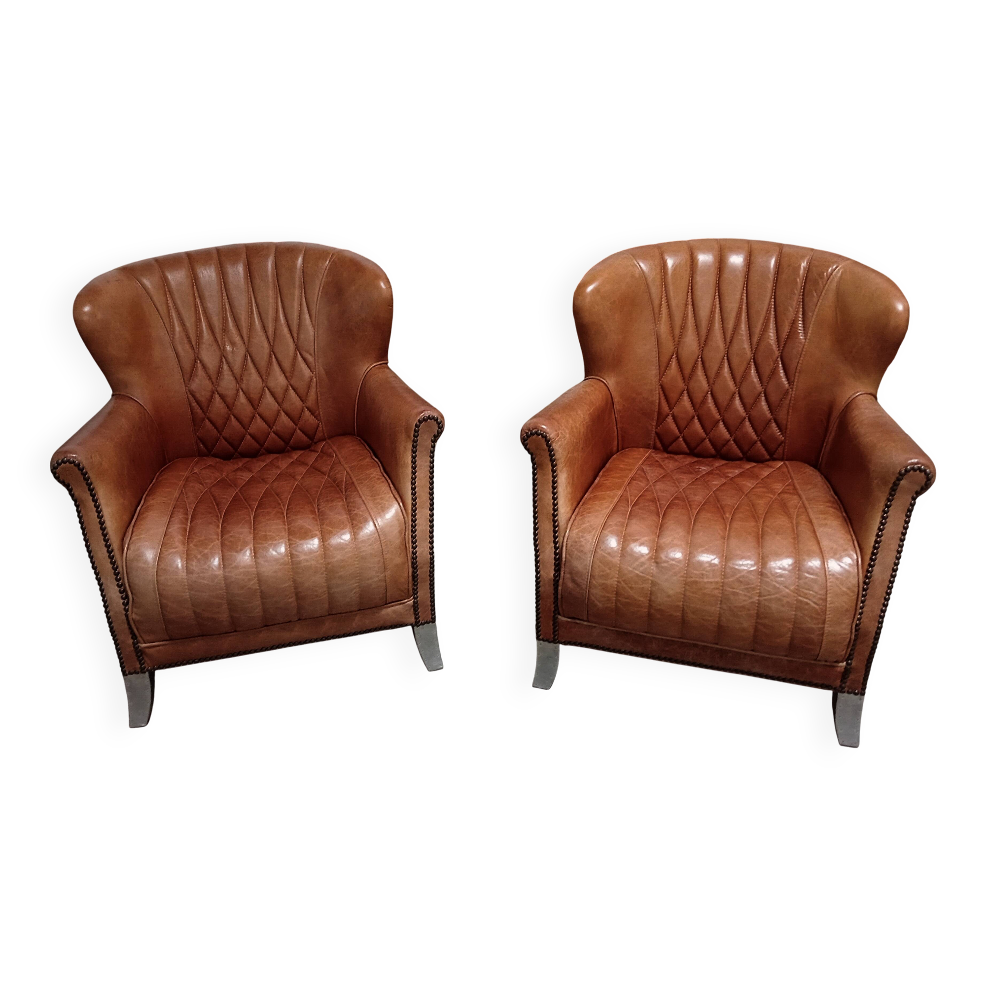 2 aviator armchairs