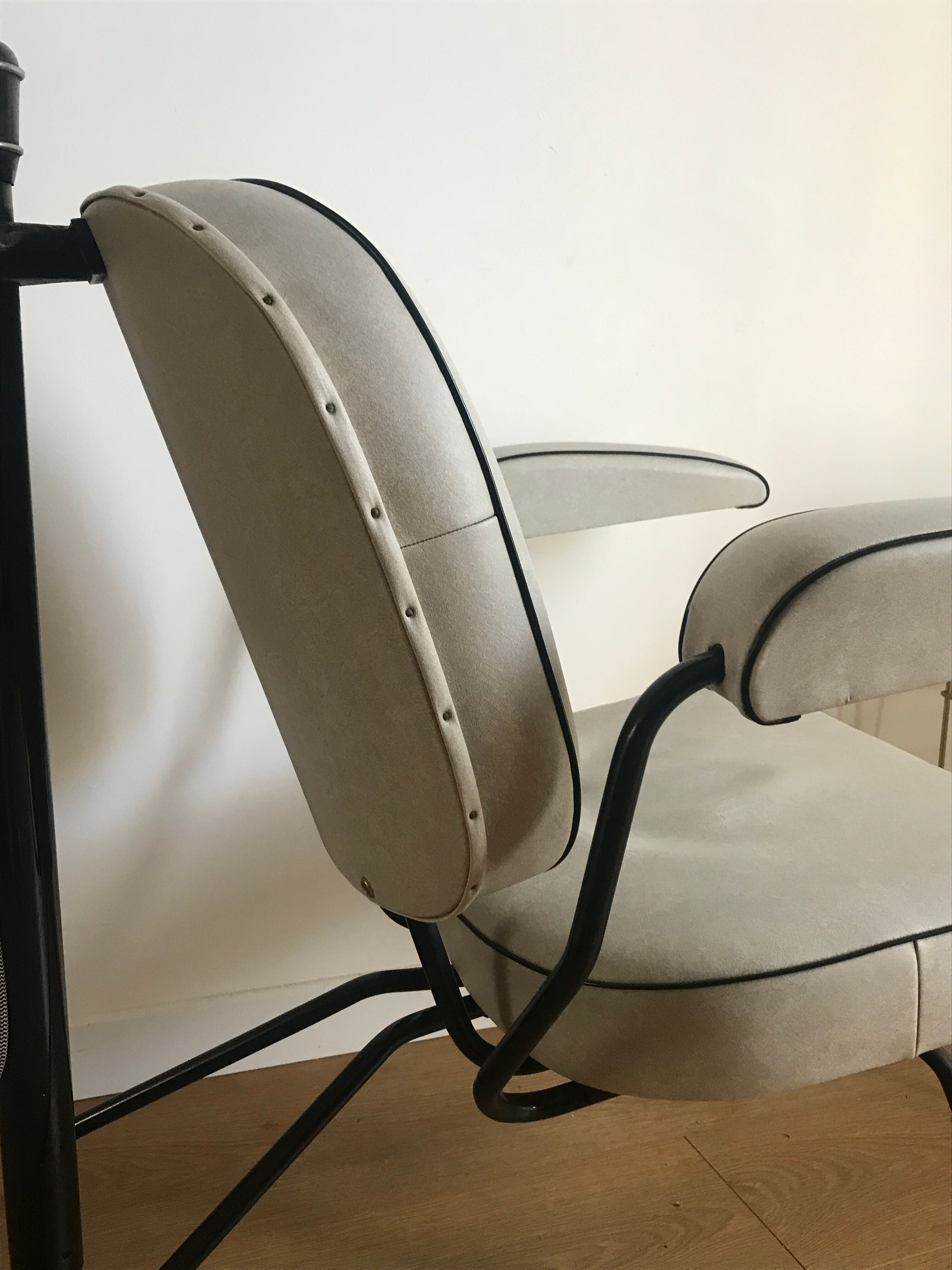 Vintage hairdresser's armchair with helmet transformed into a lamp