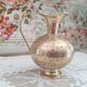 Chiseled brass pitcher decorated foliage