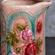 Antique slip pitcher with blooming roses
