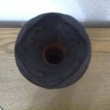 Carved turned wooden vase for dry flowers, decorated with a small horseshoe