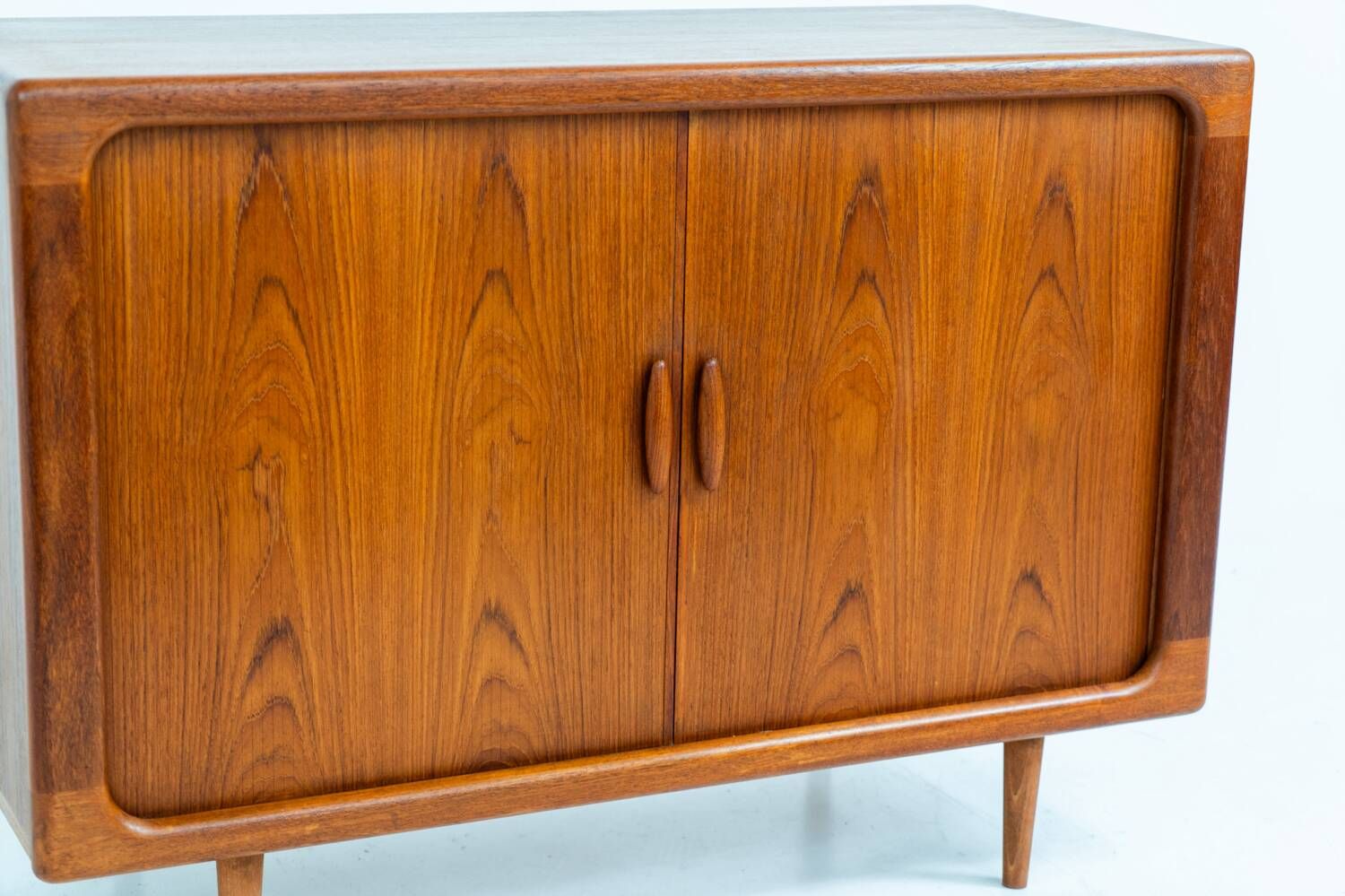 Svend Dyrlund teak sideboard with tambour doors (Denmark, 1960s).