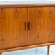 Svend Dyrlund teak sideboard with tambour doors (Denmark, 1960s).