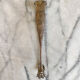 Antique silver-plated sugar tongs SFAM with monogram.