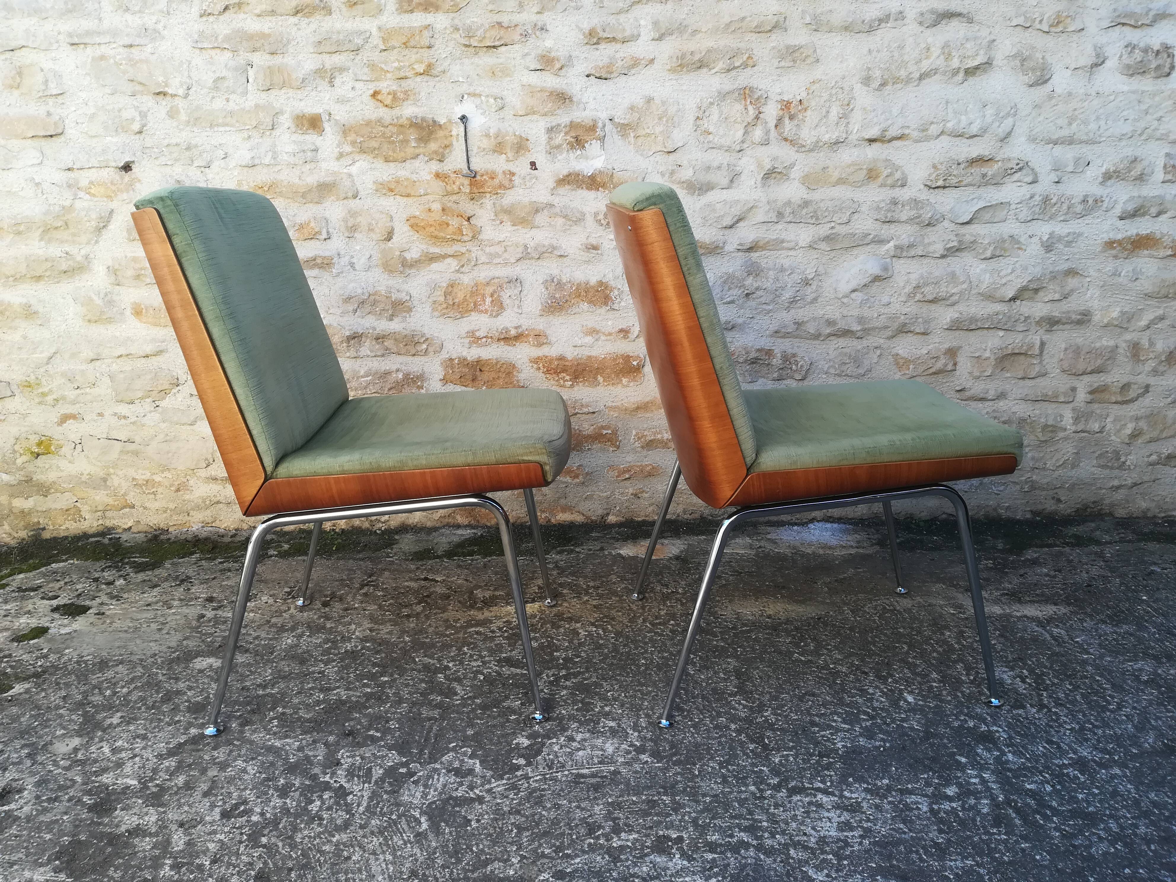 Shell chairs and green fabric
