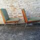 Shell chairs and green fabric