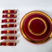set of trivets, bottle coasters and knife holders in art de cherry-colored ceramic