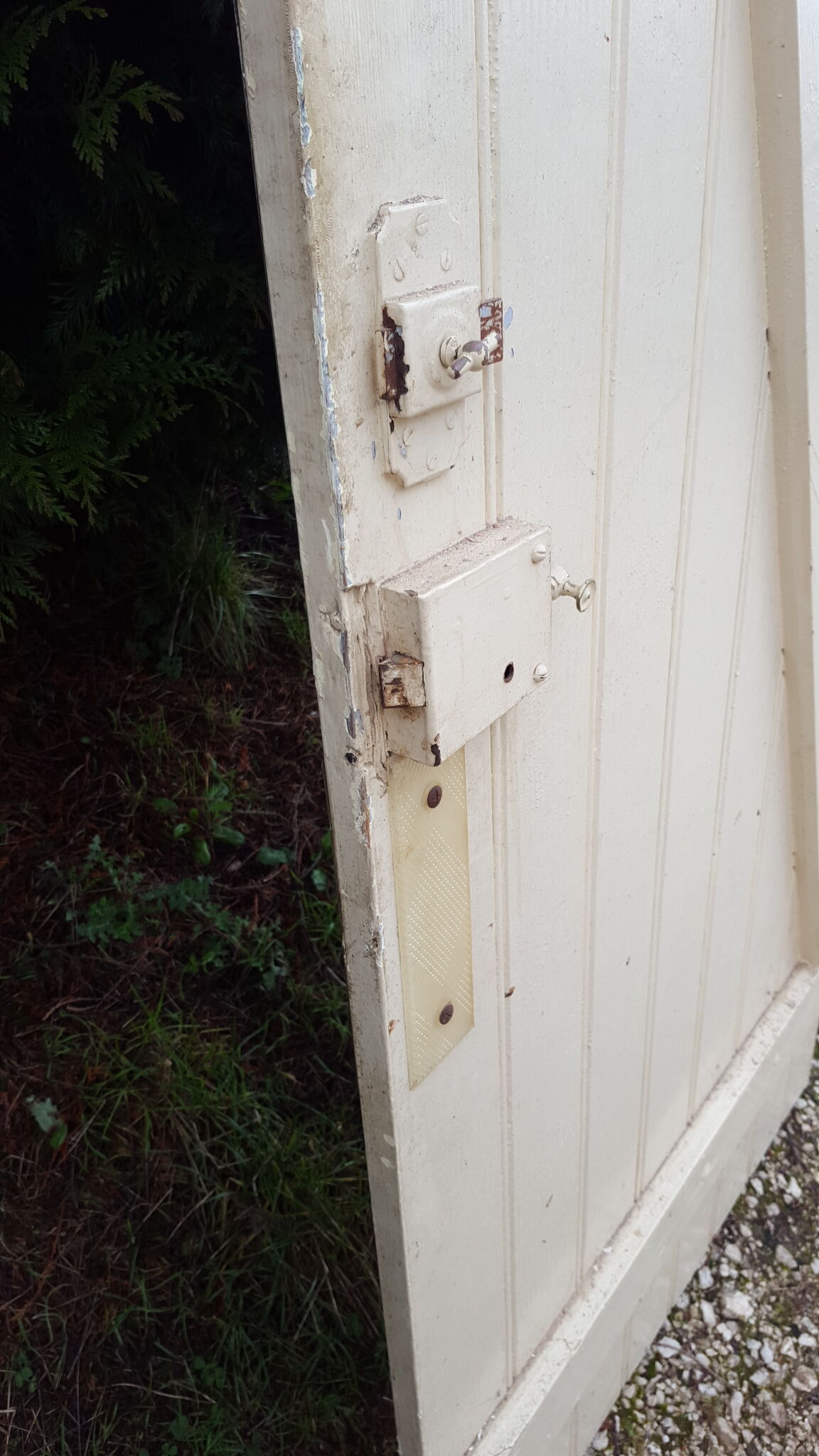 Old door in cream lacquered wood