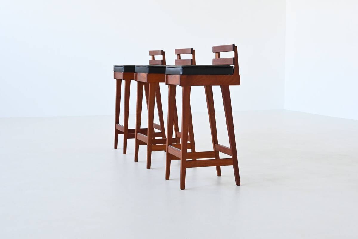 Erik Buck set of three bar stools in teak and leather Dyrlund Denmark 1960