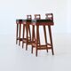 Erik Buck set of three bar stools in teak and leather Dyrlund Denmark 1960