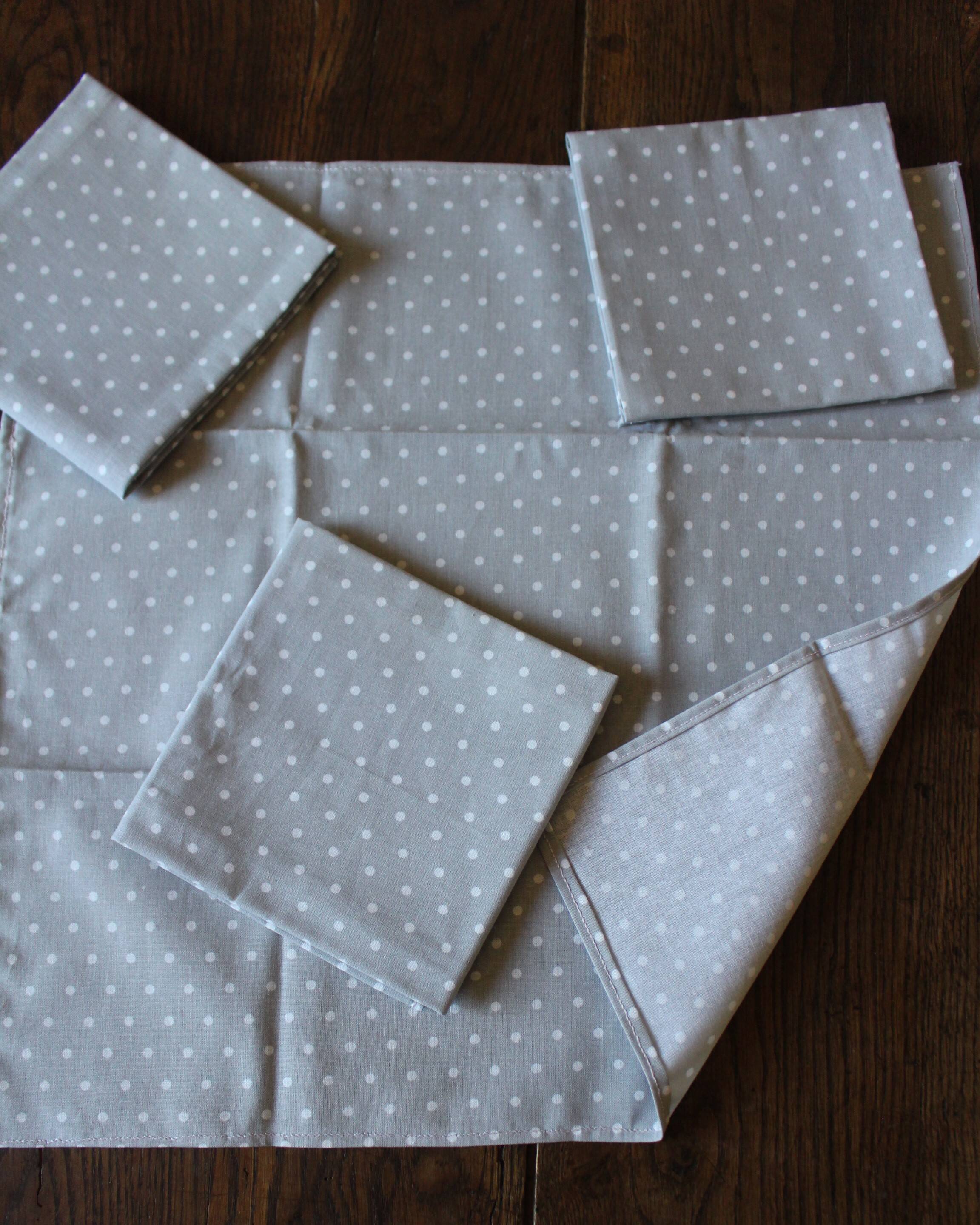 A set of 8 gray blue napkins with pink flowers and polka dots