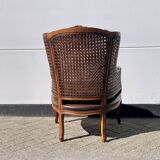 Fauteuil en rotin avec siège en cuir marron