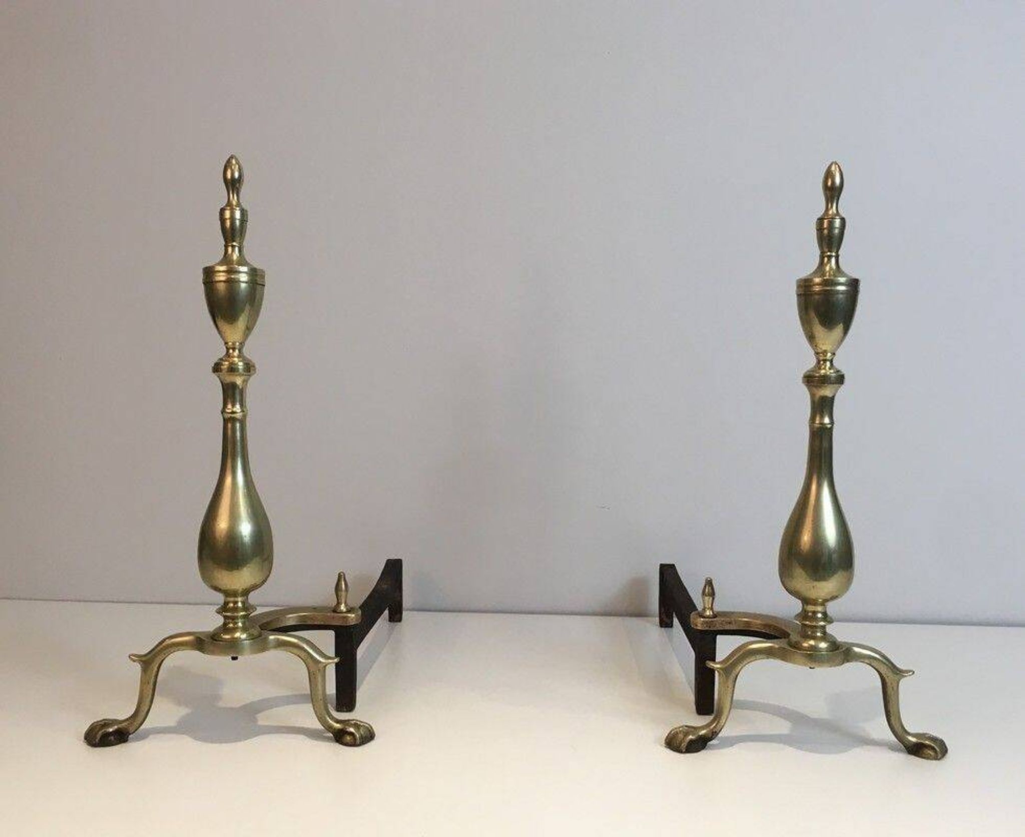 Pair of neo-Gothic bronze and wrought iron andirons