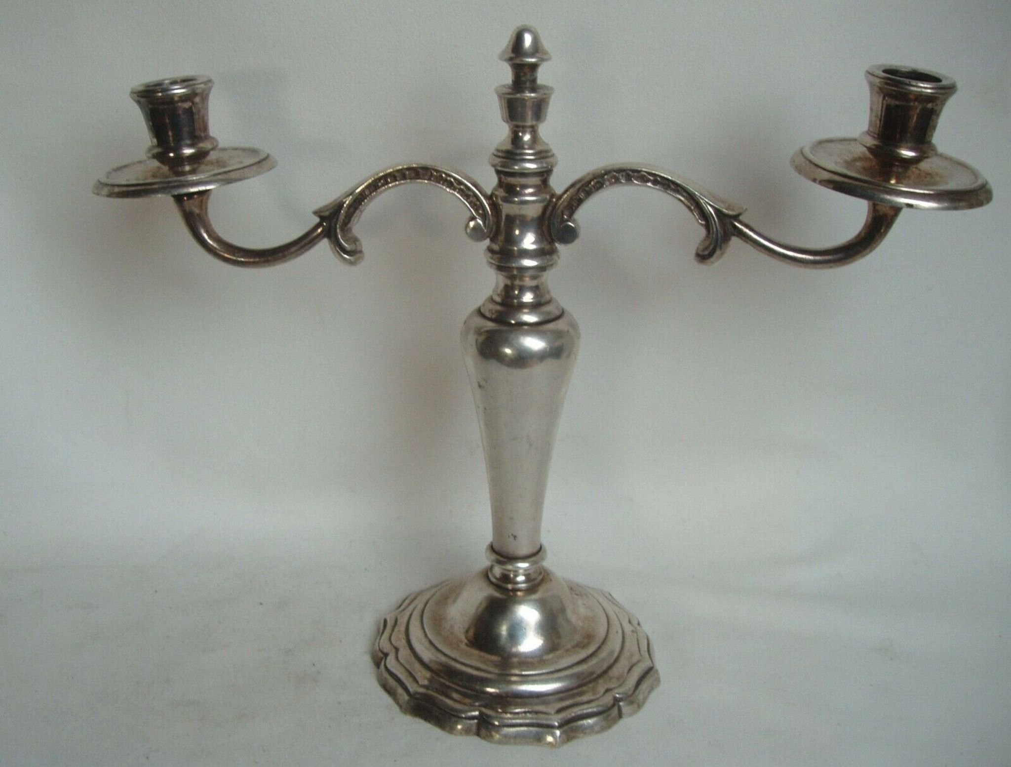 Two-branch silver-plated candle holder from the early twentieth century.