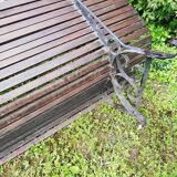 Old wooden bench and wrought iron
