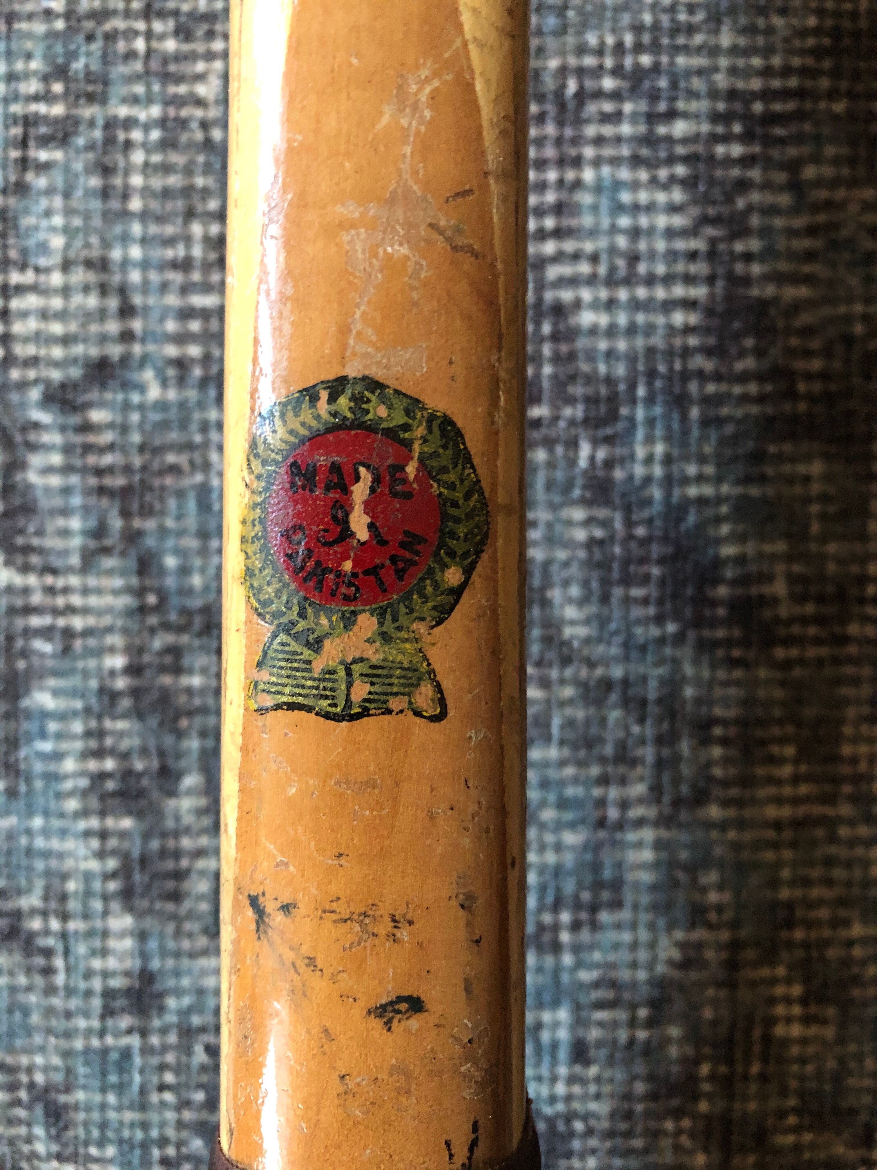 Pair of old wooden tennis rackets with 50s frames