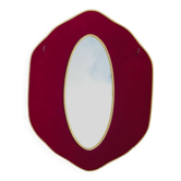 Oval wall mirror in burgundy velvet and brass – 1950s–1960s