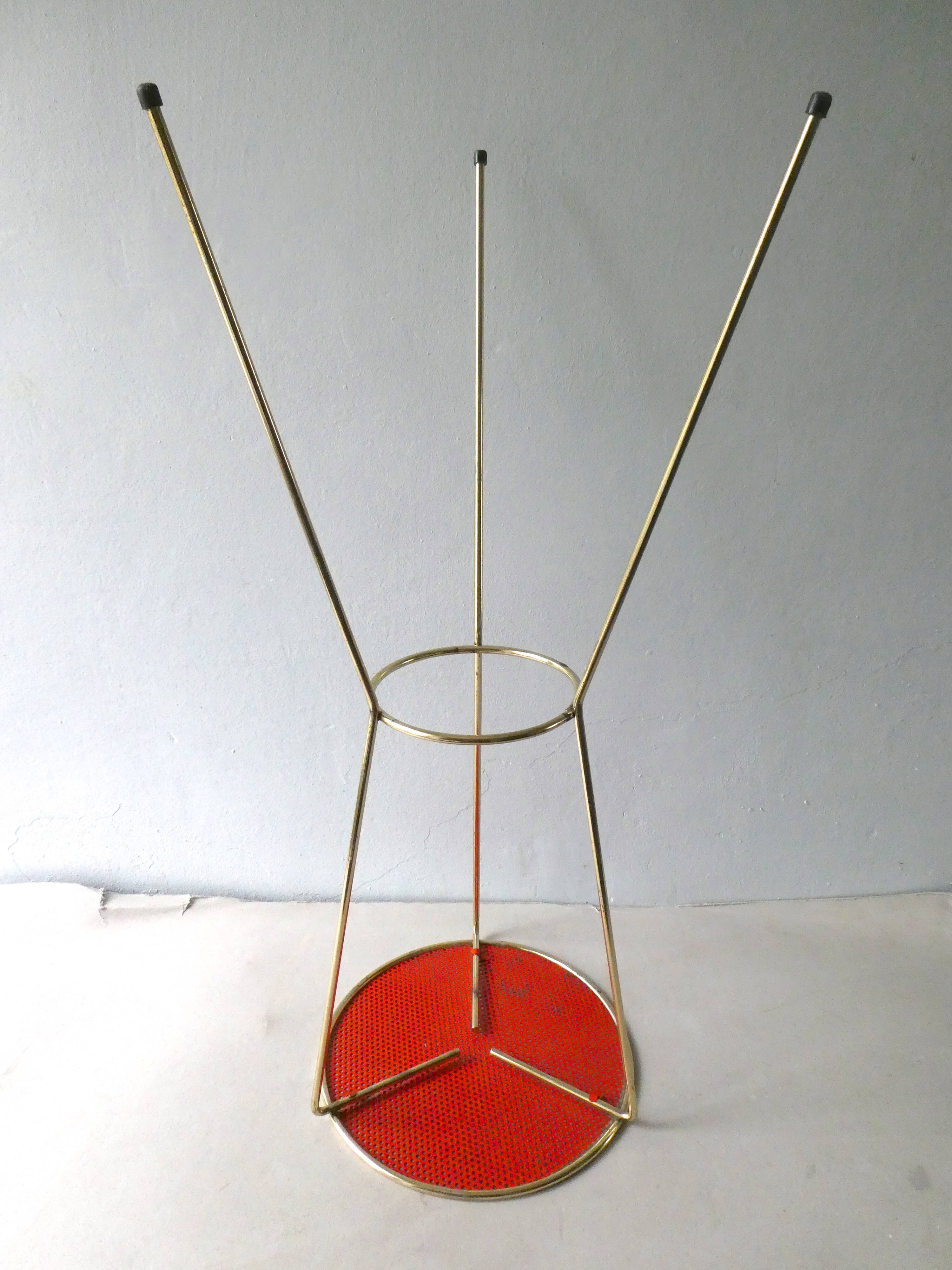 Tripod healing in gold metal and perforated metal from the 1960s
