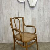 Curved wood and cane armchair