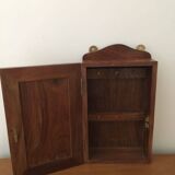Key box in wood and brass and central motif representing a sailor's anchor