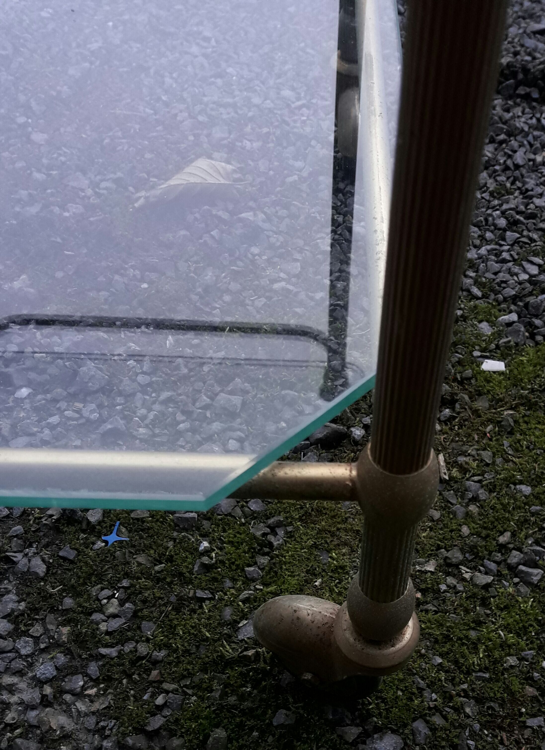 Small rolling table in glass and gold metal