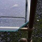 Small rolling table in glass and gold metal