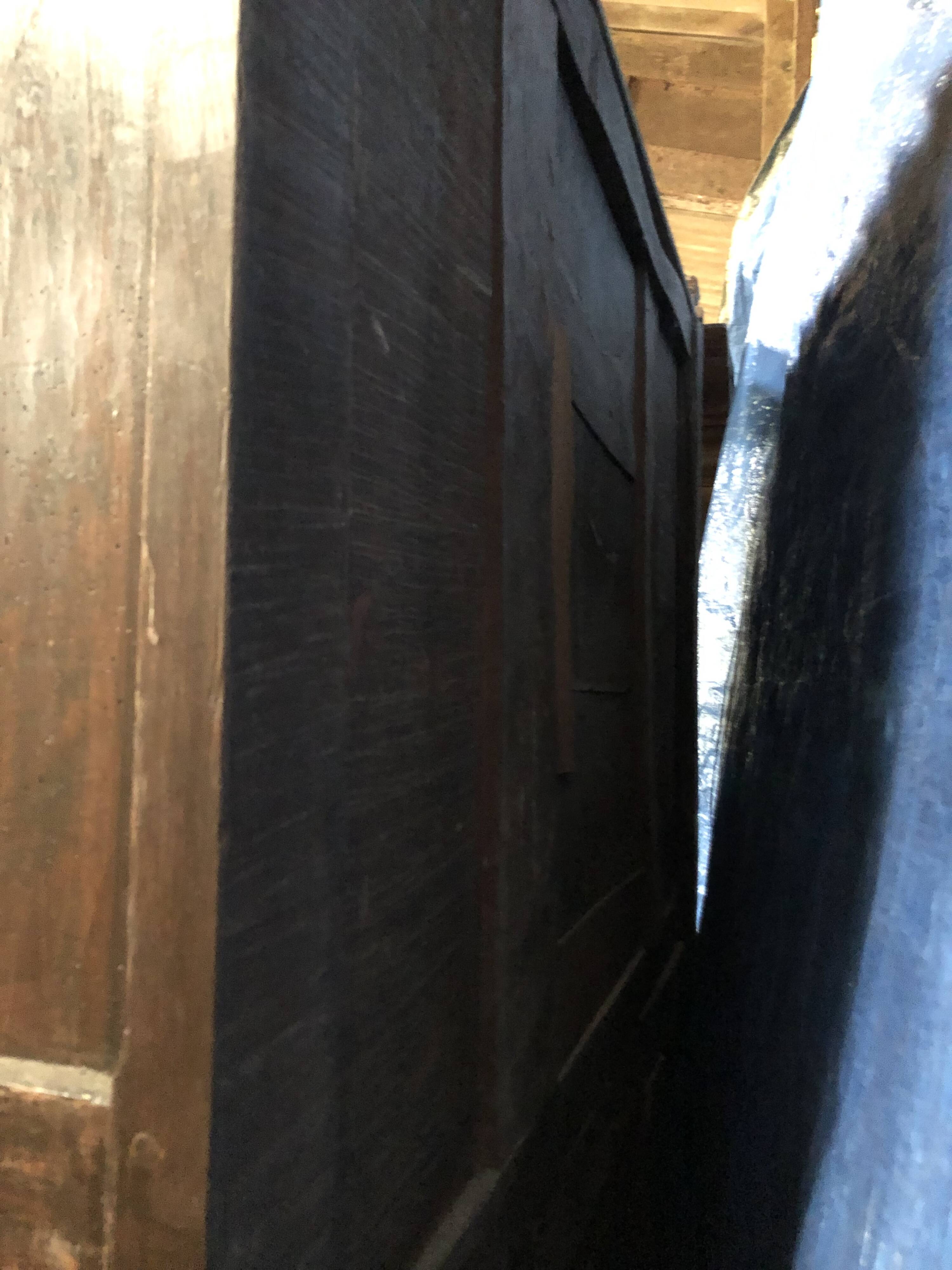 Antique Louis XIII armoire in solid walnut with carved doors