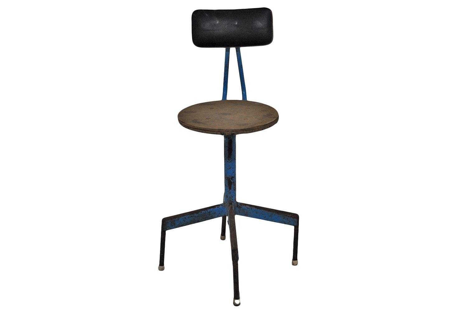 Mid-century industrial chair in metal, leather, and multicoloured wood from the 1960s.