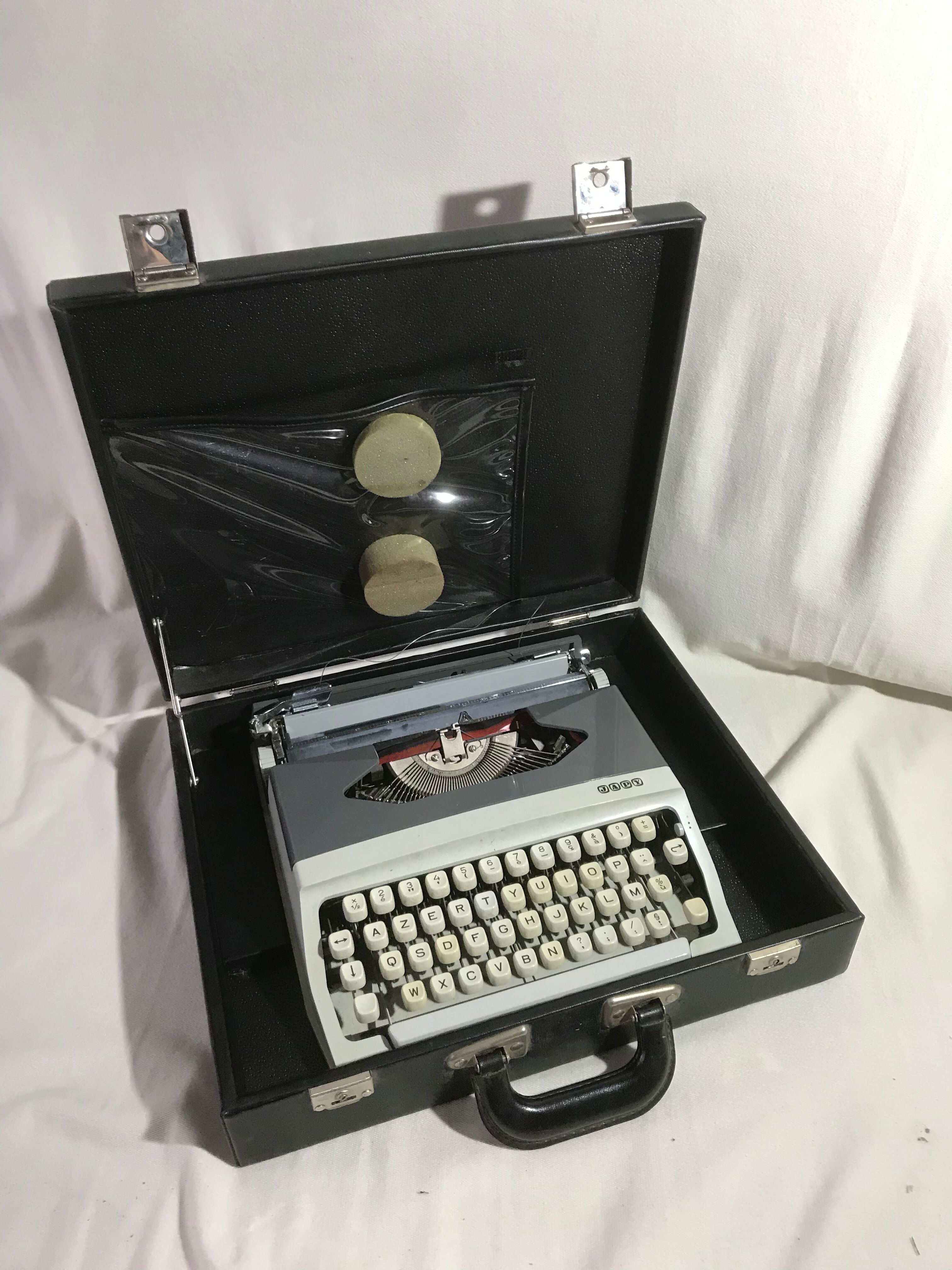 Former HJapy white metal writing machine - grey - vintage black malle