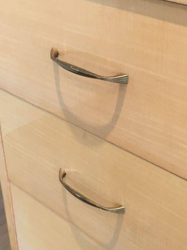Eggshell lacquered chest of drawers with brushed steel legs. In the style of Knoll.