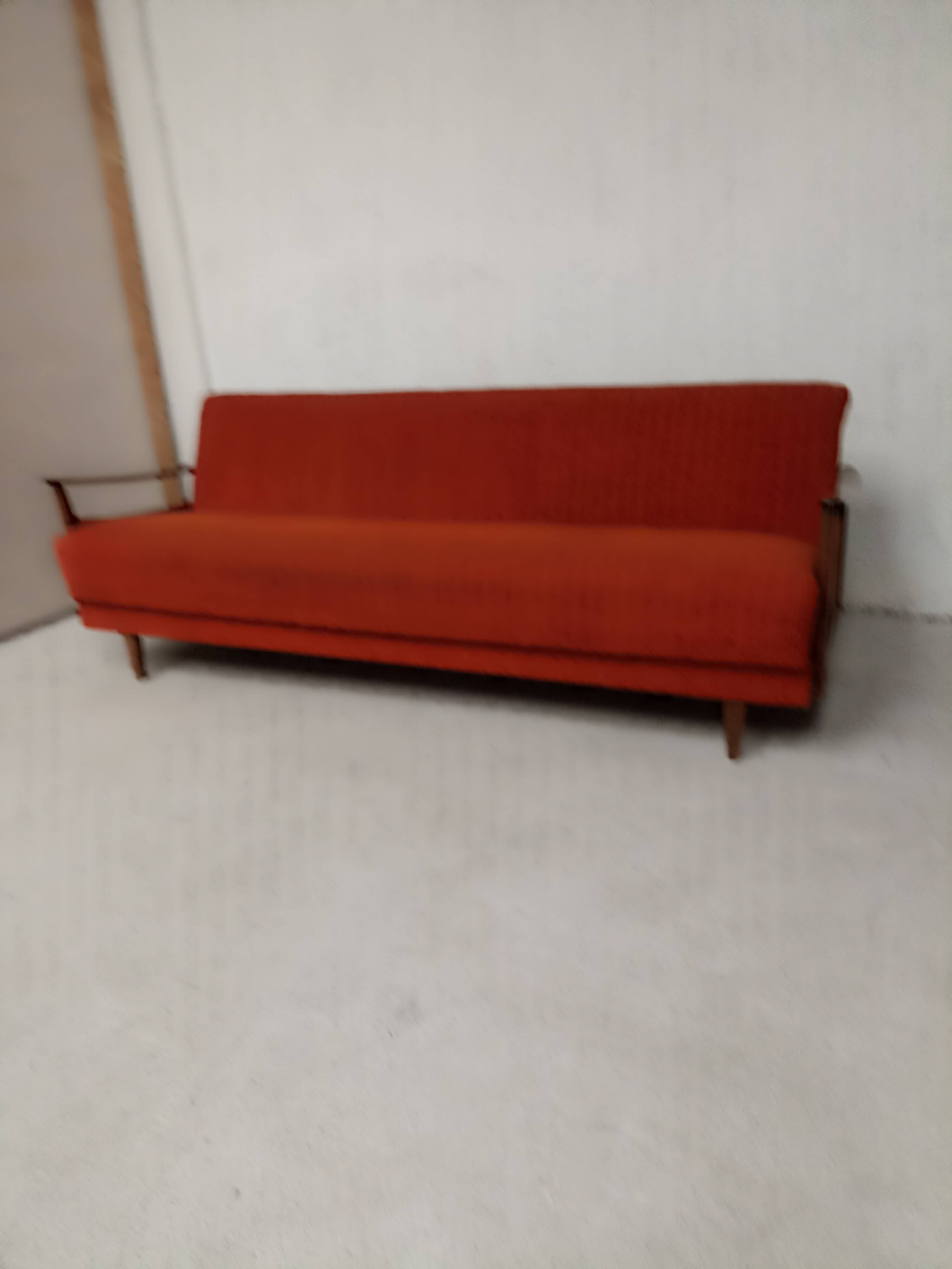 Vintage orange convertible sofa