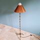 Brass floor lamp with rattan shade, 1950s-60s.